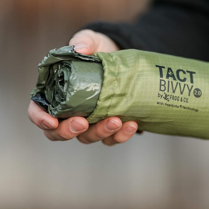 Survival Frog Tact Bivvy 2.0 Emergency Sleeping Bag w/Stuff Sack, Carabiner, Survival Whistle, ParaTinder - Compact, Lightweight, Waterproof, Reusable, Thermal Bivy Sack Cover, Shelter Kit